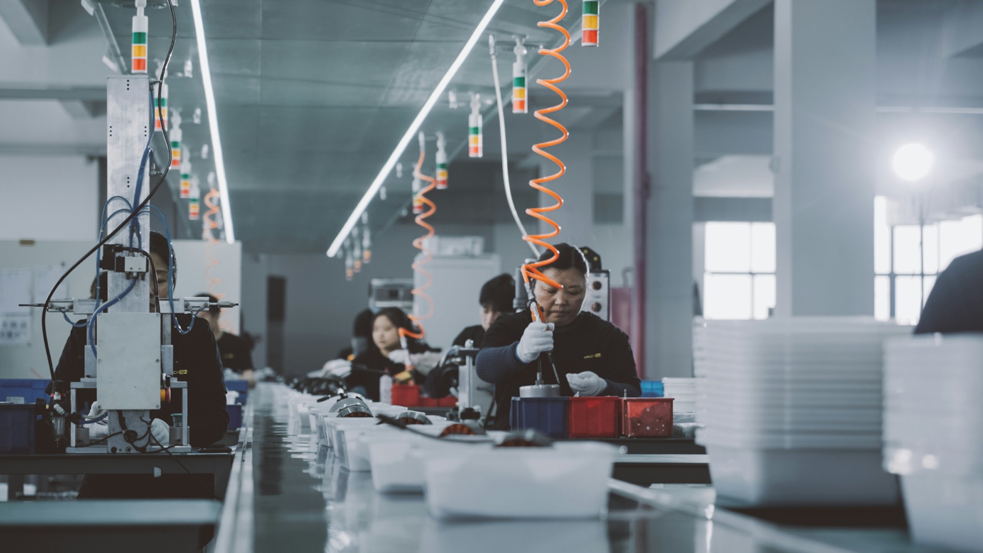 People working on a factory floor